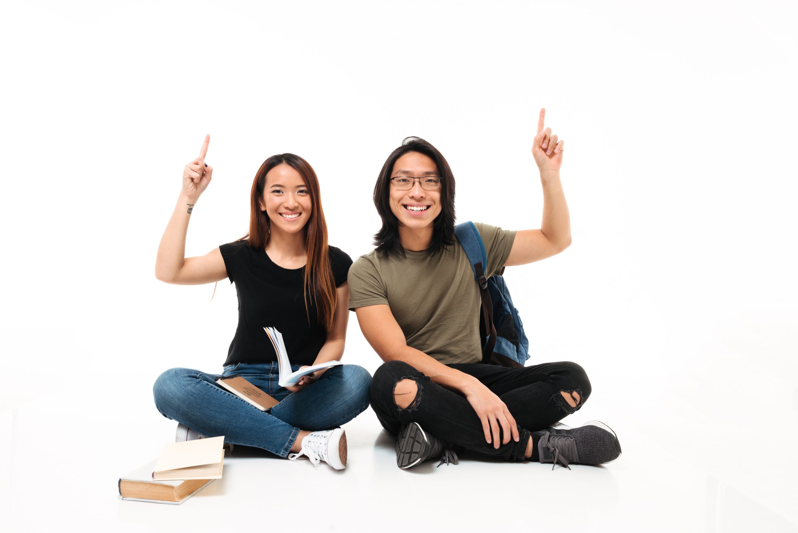 Portrait of a smiling cheerful asian students couple