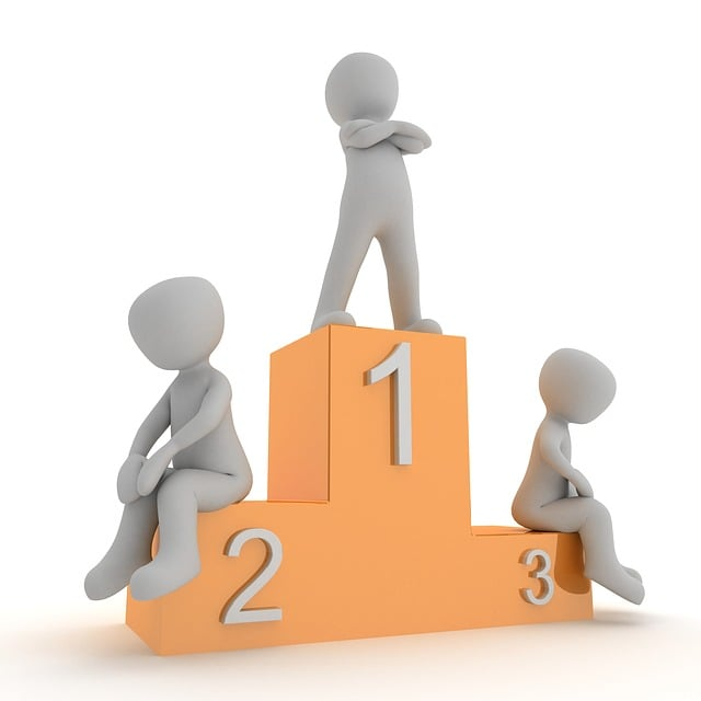 Yellow podium with 1, 2 and 3 and a figure standing proud on 1 and two figures head hung low on 2 and 3.